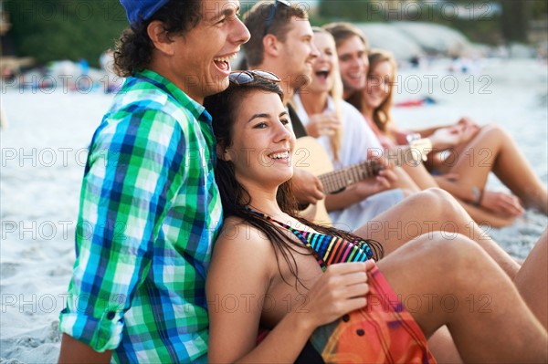 Group of friends relaxing at beach