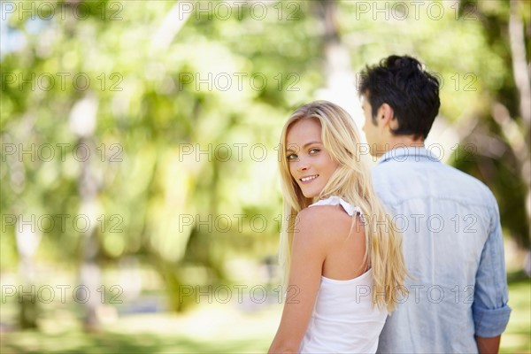 Couple walking in park