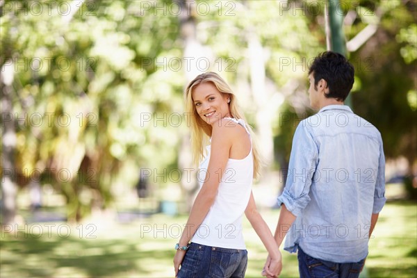 Couple walking in park