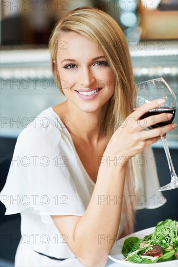 Woman eating lunch in restaurant
