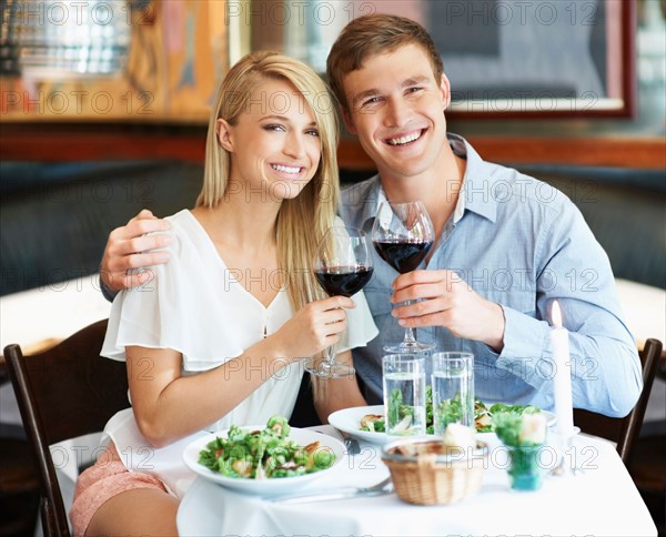 Couple drinking wine in restaurant