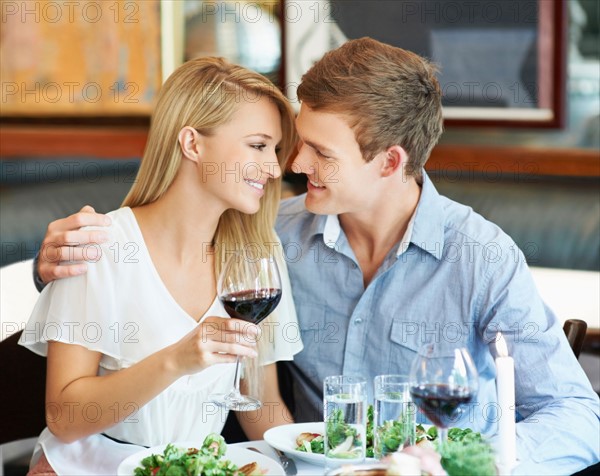 Couple drinking wine in restaurant