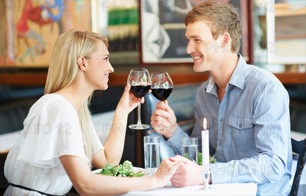 Couple drinking wine in restaurant