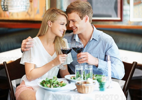 Couple drinking wine in restaurant