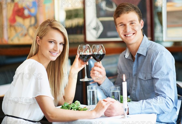 Couple drinking wine in restaurant