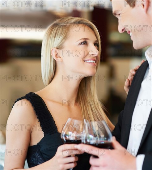 Couple drinking wine in restaurant