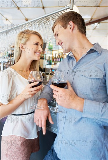 Couple drinking wine in bar