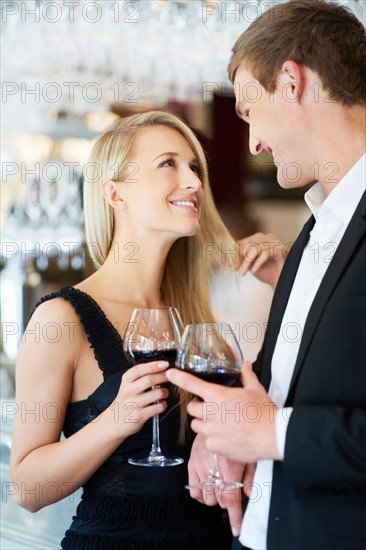 Couple drinking wine in restaurant