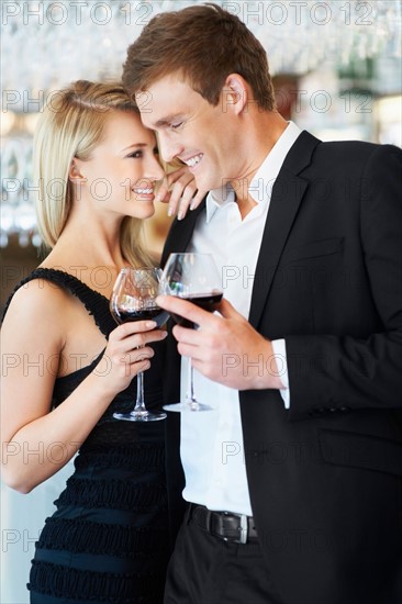 Couple drinking wine in restaurant