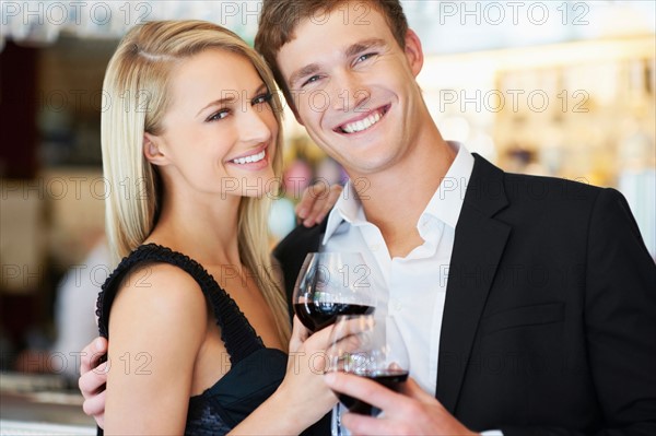 Couple drinking wine in restaurant