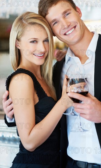 Couple drinking wine in restaurant