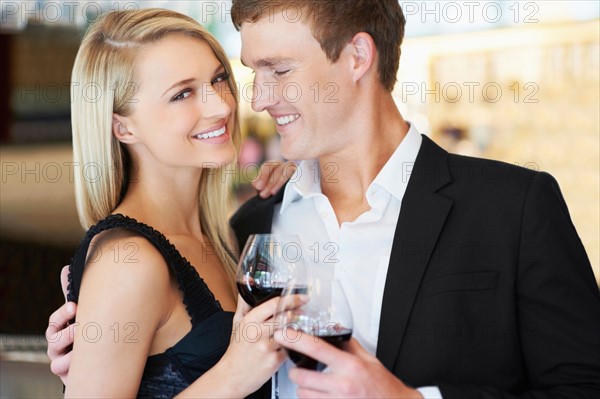 Couple drinking wine in restaurant