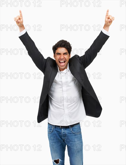 Studio portrait of stylish man celebrating