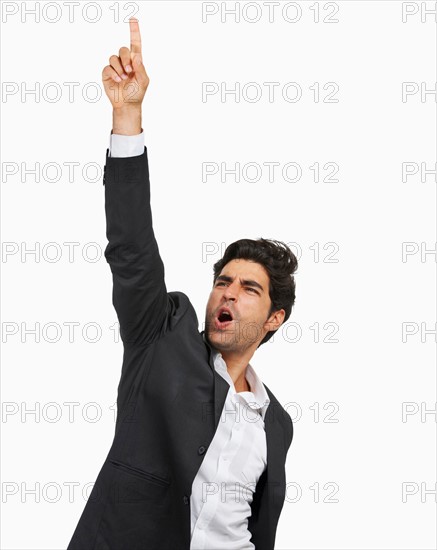 Studio portrait of stylish man cheering