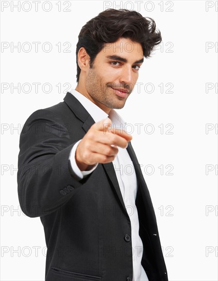 Studio portrait of stylish man pointing