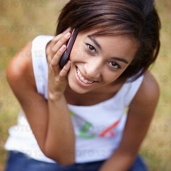 Portrait of young woman in using mobile phone