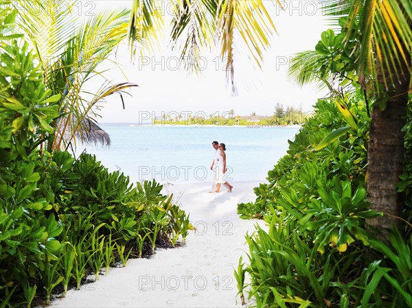 Couple walking at beach