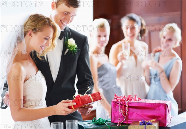 Wedding couple opening gifts