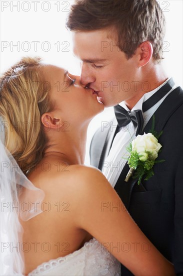 Bride and groom kissing