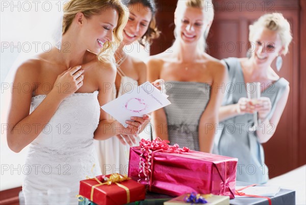 Bride  and bridesmaids unpacking gifts