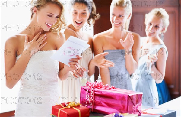 Bride  and bridesmaids unpacking gifts