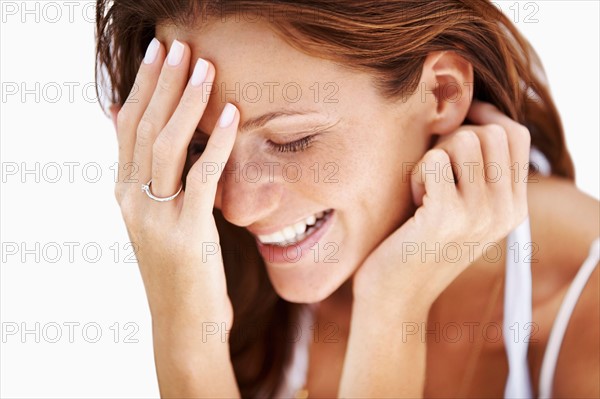 Studio portrait of laughing woman