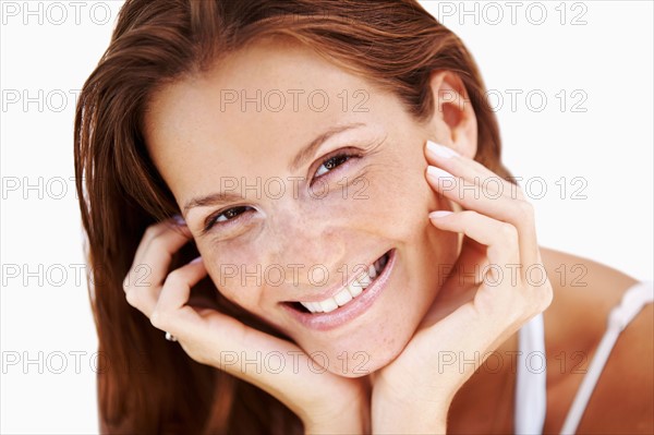 Studio portrait of woman smiling