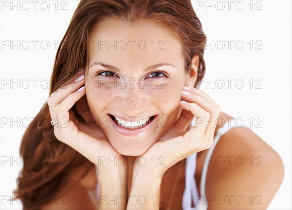 Studio portrait of woman smiling