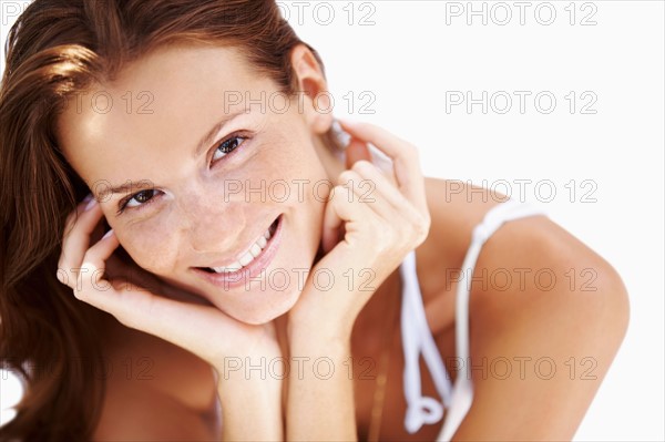 Studio portrait of woman smiling