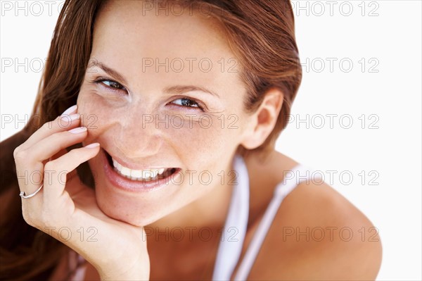 Studio portrait of woman smiling