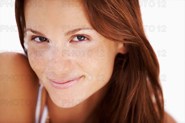 Studio portrait of woman smiling