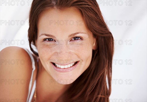 Studio portrait of woman smiling