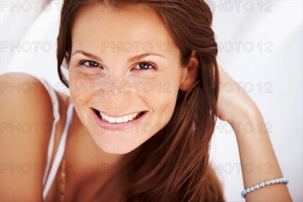 Studio portrait of woman smiling