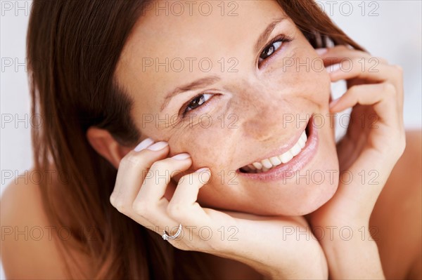 Studio portrait of woman smiling