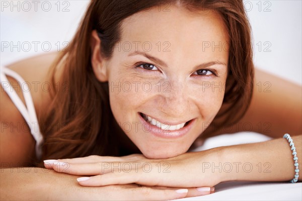 Studio portrait of woman smiling