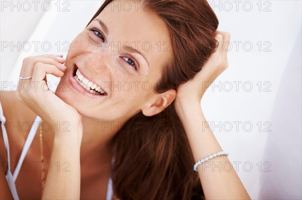 Studio portrait of woman smiling