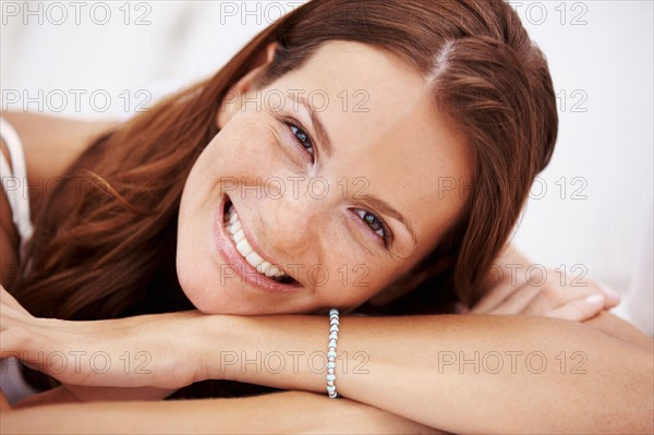 Studio portrait of woman smiling