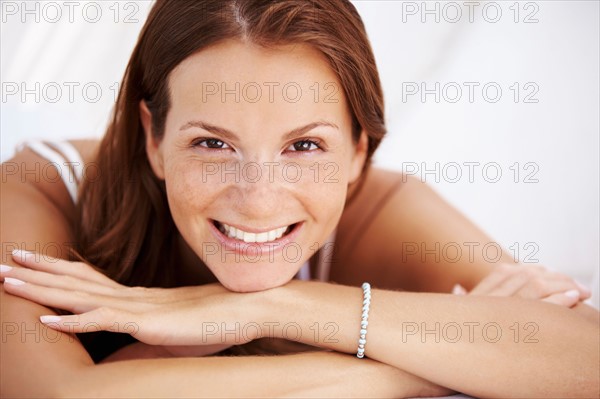 Studio portrait of woman smiling