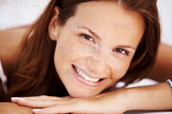 Studio portrait of woman smiling