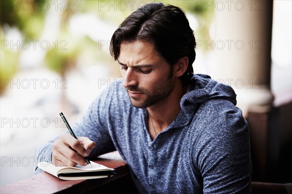 Man writing diary