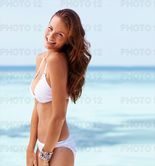 Portrait of smiling young woman in bikini