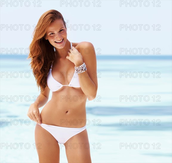 Portrait of smiling young woman in bikini