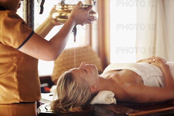 Woman getting aromatherapy in spa