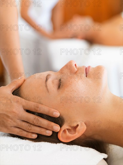 Two people getting massage in spa