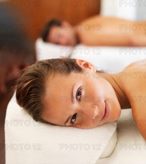 Two people getting massage in spa