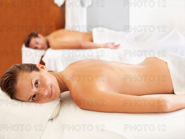 Two people getting massage in spa