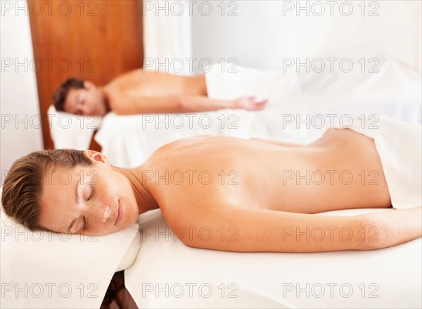 Two people getting massage in spa