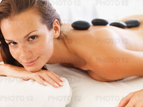 Woman getting lastone therapy in spa