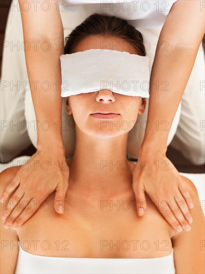 Woman receiving massage in spa