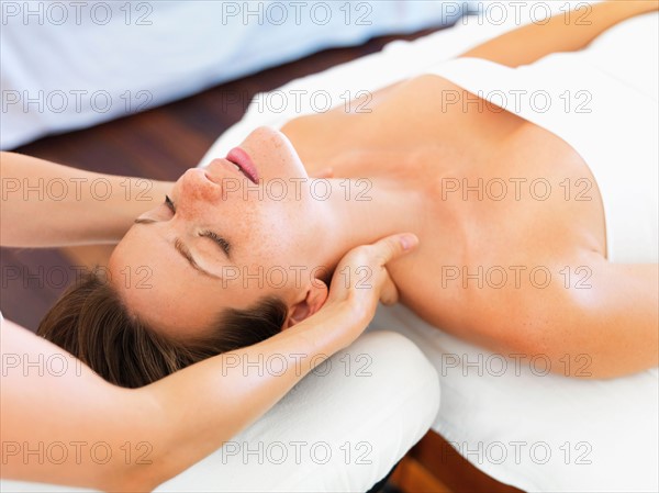 Woman receiving massage in spa